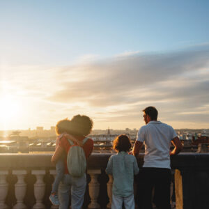 A family watching the sun set over Brussels from Place Poelaert.
