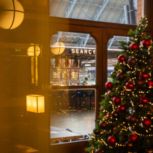 A Christmas tree in the window of St Pancras Bar and Brasserie.