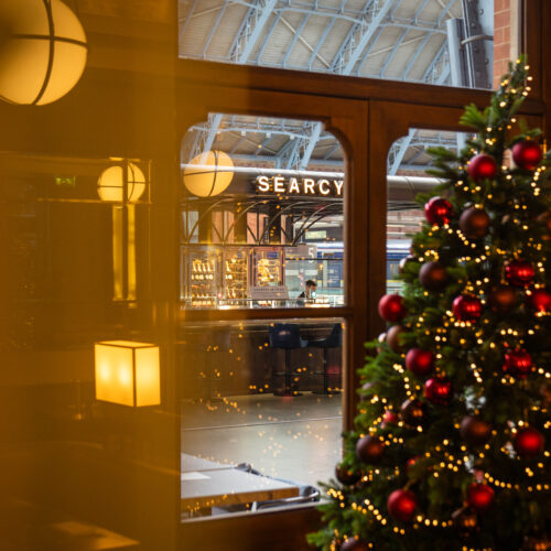 A Christmas tree in the window of St Pancras Bar and Brasserie.