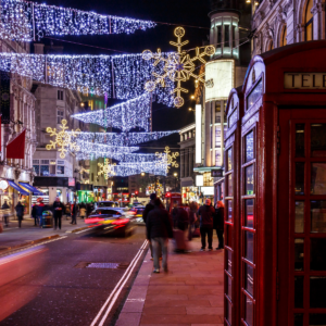 A busy london street filled with Christmas lights